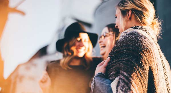 A Group of Woman Talking and Laughing.