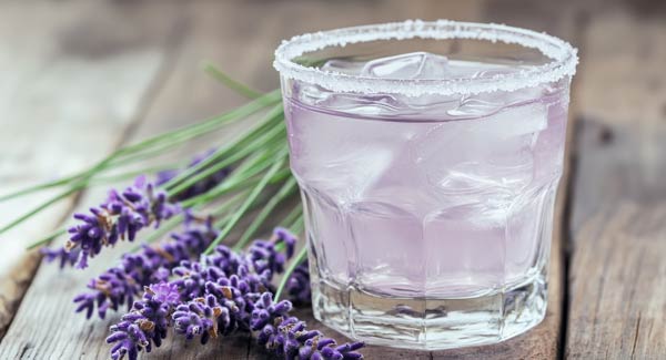 A Glass Filled with Lavender Vodka and How you Can Make a Lavender Vodka Cocktail.